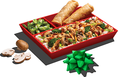 Bento meal alongside mushrooms and gift bow